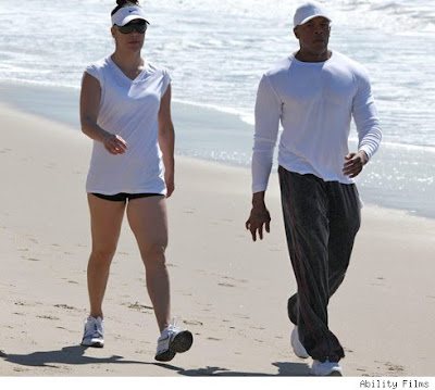 Dr Dre and his wife seen walking on the beach in Malibu