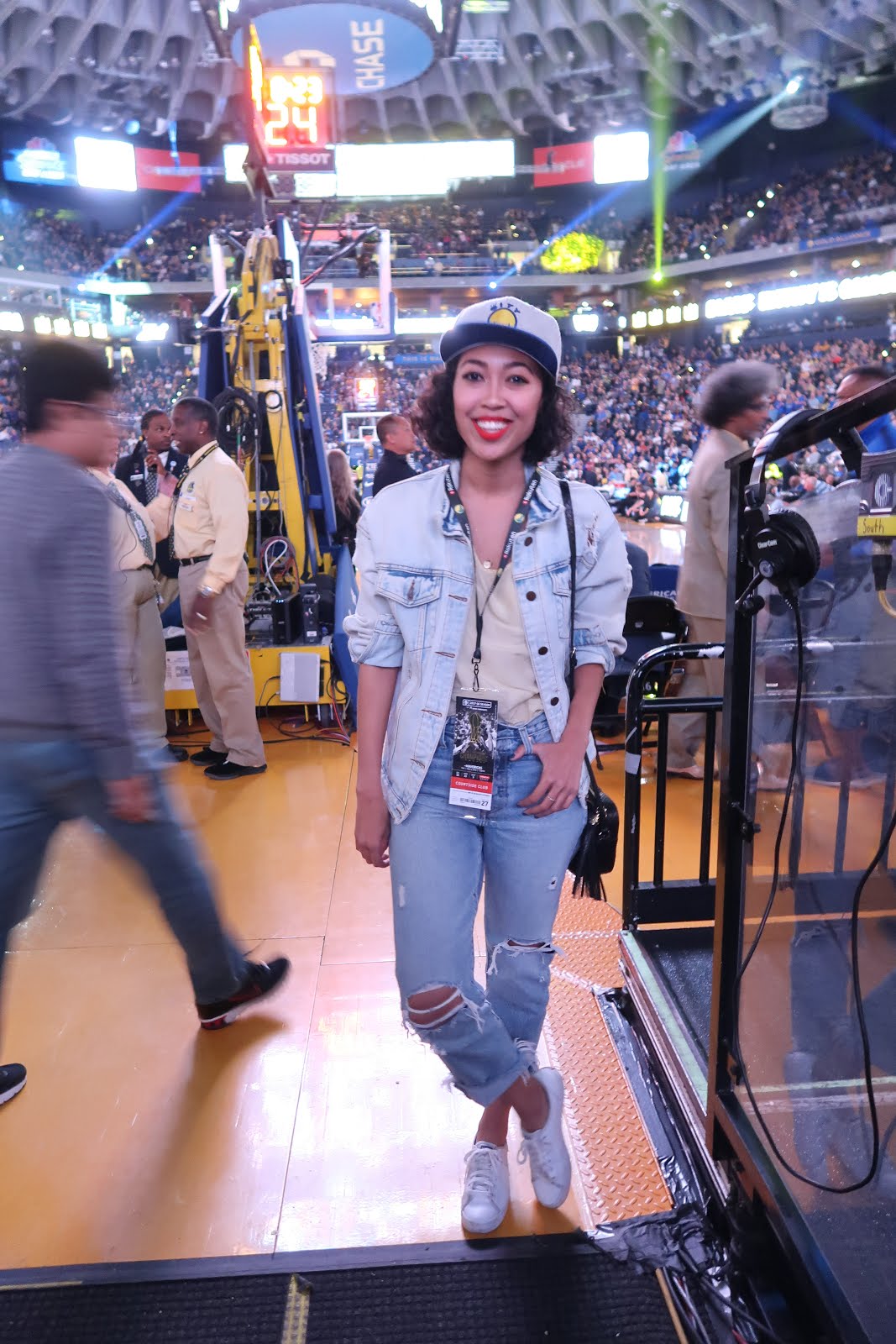 What to wear to a Warriors Game: Distressed Jeans, team colors, and a snapback cap.