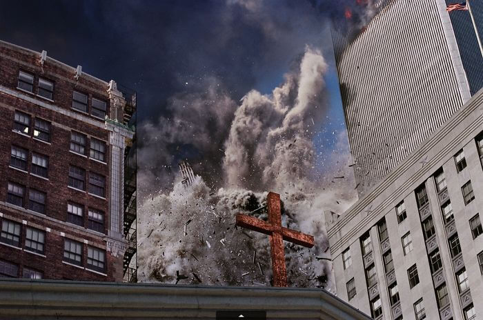 18 Rare Historical 9/11 Photos That You Most Possibly Haven't Seen Before - The South Tower Disintegrates, Raining Debris Behind A Cross Atop Trinity Church