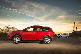 Side view of 2015 Toyota RAV4 Limited AWD with another RAV 4 in background