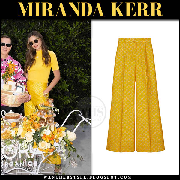 Miranda Kerr in yellow short sleeve top and yellow trousers