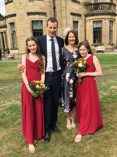 family group in wedding outfits