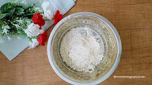 Draining soaked basmati rice in a colander - Ready for cooking