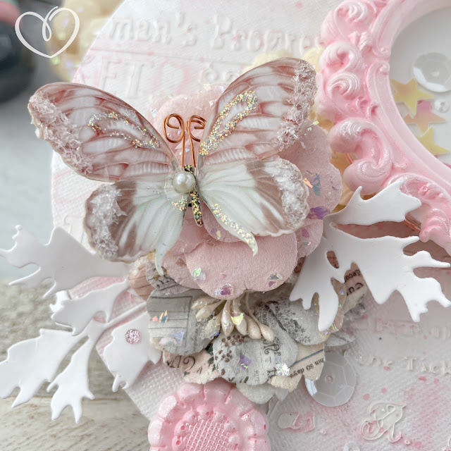 Mixed media shaker canvas created with: Sizzix circle panes, circle frames, creamy matte acrylic in cherry blossom, woodland stems, dimensional paste, pearlescent medium, sequin mix in ballet slipper; Prima lavender frost paper flowers, Finnabair mirror frame moulds, theater night stencil; Pinkfresh Studio glitter drops in blush; Reneabouquets butterflies