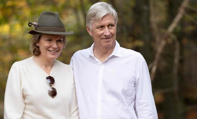 Queen Mathilde wore a Sherpa camel jacket by Attic and Barn. Chloe Eria sunglasses. Penelope Chilvers long tassel boots
