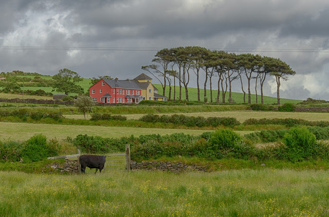 cloudy sky over farm fields