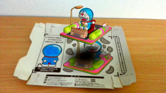 http://en.rocketnews24.com/2014/07/14/japans-glico-lets-snackers-turn-their-empty-boxes-into-augmented-reality-sets-for-doraemon/