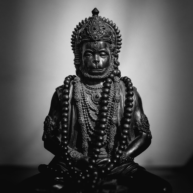 gold Buddha figure on black table