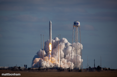 Rocket launch with billowing smoke