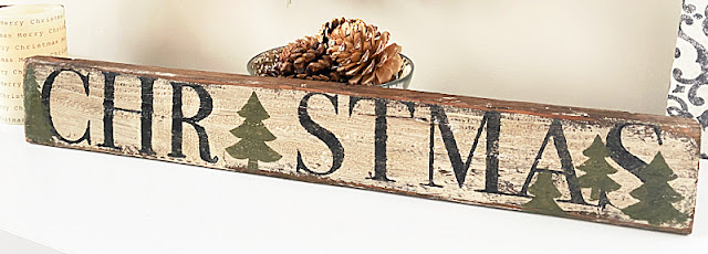 Christmas sign with pinecones