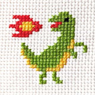 Tiny fire breathing T-Rex cross stitch pattern