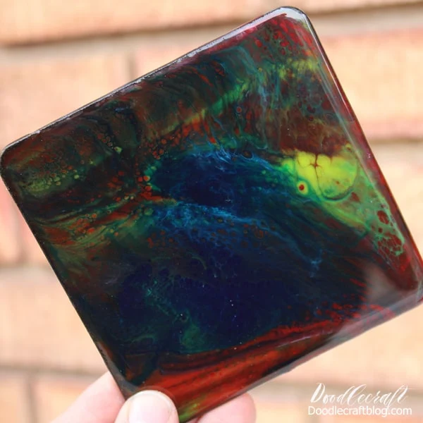 Make stunning galaxy coasters with high gloss resin and vivid colors. These amazing coasters are addicting to make with this fun resin pour technique.