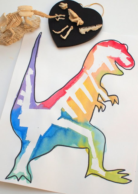 great kids art and STEM project- masking tape resist dinosaur bone paintings