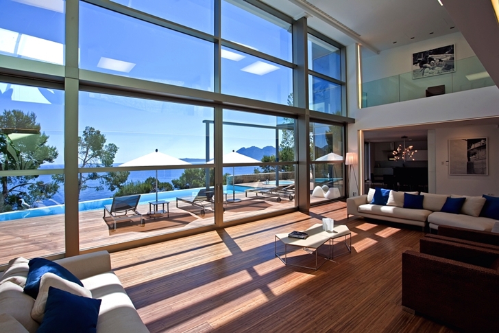 Glass wall in living room of Modern mansion on the cliffs of Mallorca 