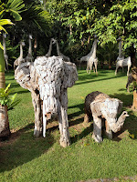 view of gardens and elephant sculptures made out of wood