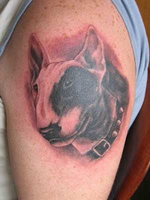 Amazing foo dog tattoo design on man's left arm. dog tattoo design.