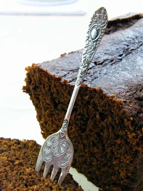 Close up of Treacle Gingerbread Loaf with a fork pronged into the cake