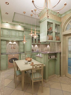 [Green and ivory french country style kitchen with bronze-colored metal light fixtures]