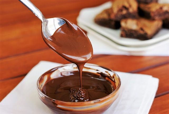 Melted Chocolate Dripping from a Spoon Image