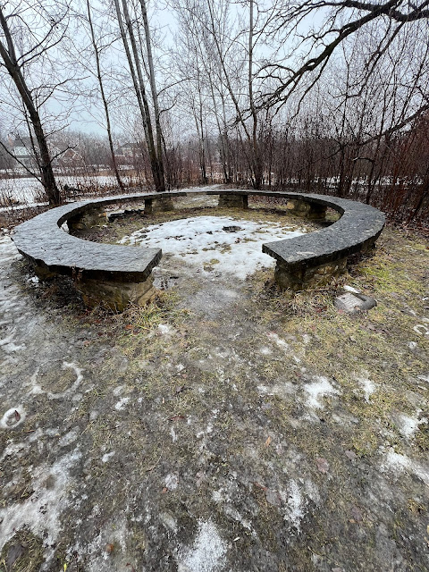 A Jens Jensen council ring looks over the pond.