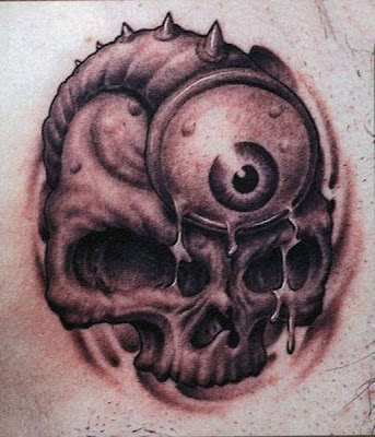 Skull Tattoo for Free Design Tattooed in the Lower Back 