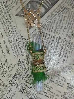 decorated recycled glass vial necklace with green sari silk