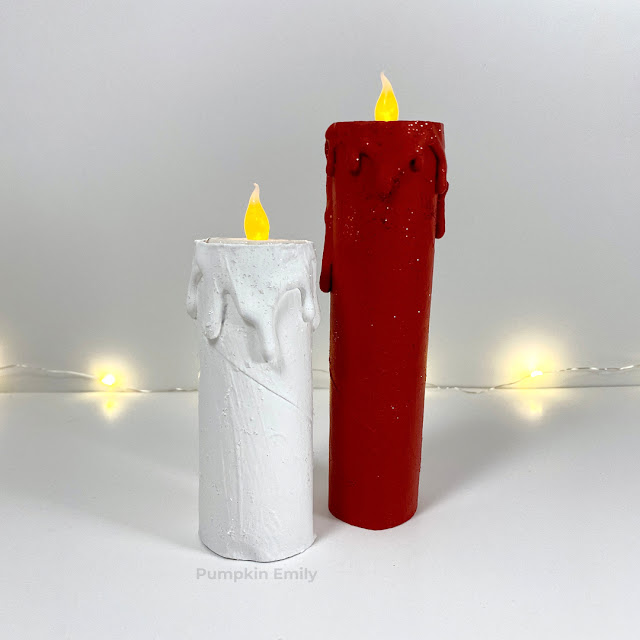White and red candles made out of paper rolls.