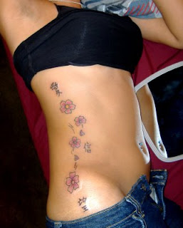 Top Cherry Blossom Tattoo Designs With Image Female Tattoo With Japanese Cherry Blossom Tattoo On The Side Body Picture 1