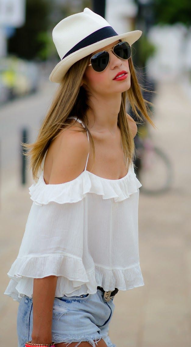 what to wear with a white blouse : hat + shorts + sunglasses