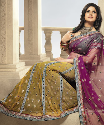BRAND: Brijraj  CATEGORY: Lehenga Saree with Unstitched Blouse  COLOUR:  Saree: Purple and Mustard  Blouse: Green  MATERIAL:  Saree: Net  Blouse: Poly Dupion