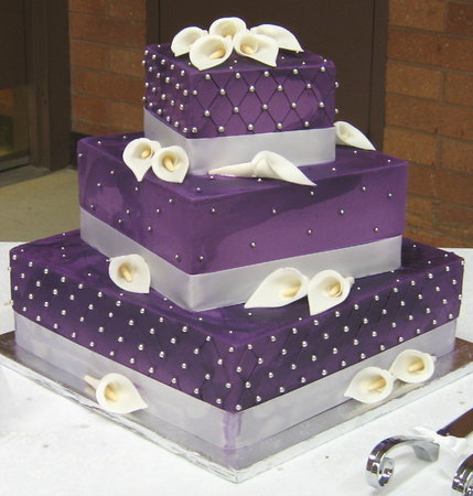 Photo Wedding Cake on The Cake Is Covered In A Purple Fondant  Decorated With Brushed