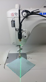 Using a sewing machine laser to sew half square triangles