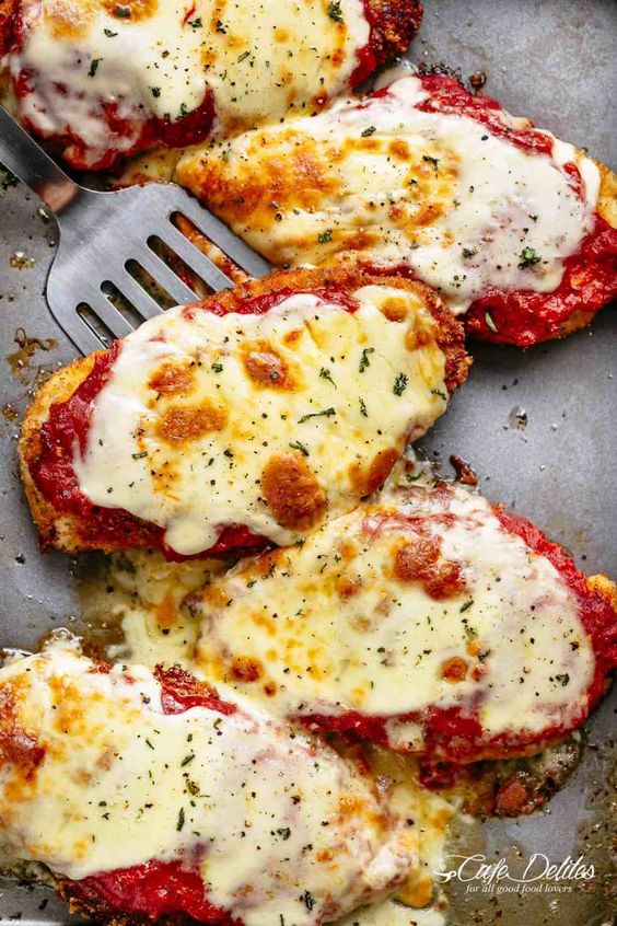 The Best Chicken Parmesan with a deliciously crispy breadcrumb coating, smothered in a rich homemade tomato sauce and melted mozzarella cheese! This is here best Chicken Parmesan you will ever make! Simple to make and worth every minute. If you love a crispy crumb coating vs soggy crumb, look no further! The Best Chicken Parmesan with a deliciously crispy breadcrumb coating, smothered in a rich homemade tomato sauce and melted mozzarella cheese! This is here best Chicken Parmesan you will ever make! Simple to make and worth every minute. If you love a crispy crumb coating vs soggy crumb, look no further!
