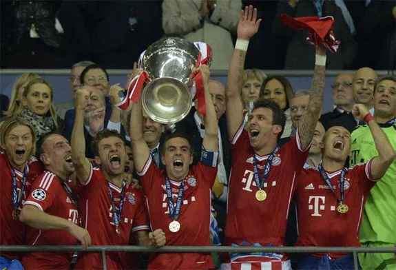 Bayern Munich captain Philipp Lahm lifts the trophy after winning the Champions League Final