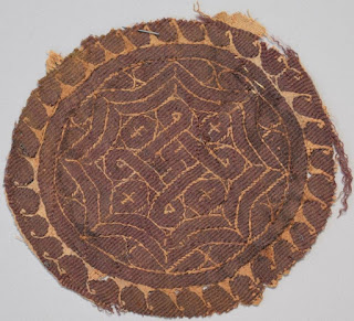 Egyptian cloth with swastika and other designs.