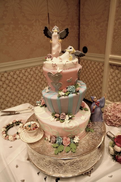 Gorgeous four tier blue Cinderella Disney wedding cake with elaborate blue