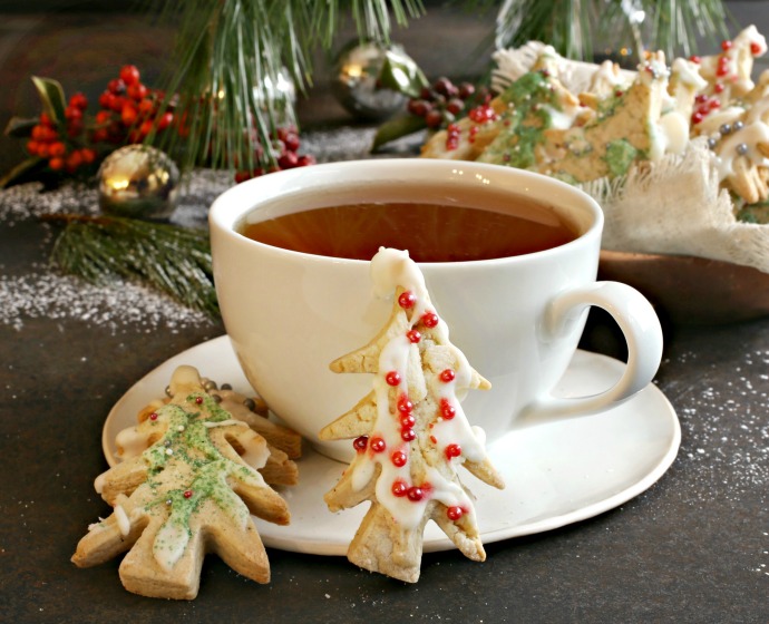 Recipe for shortbread cookies made with brown butter, frosted with white chocolate royal icing and sprinkles.