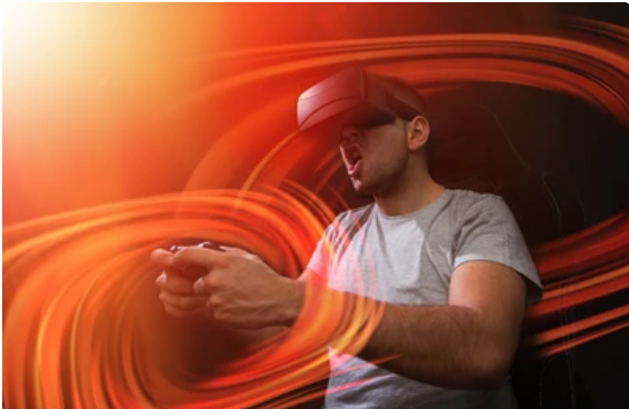 Man is wearing a VR Headsets and playing games