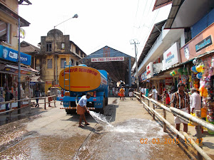 "Water Tanker" cooling the hot road  for the "ANAYOTTAM(Elephant Race).