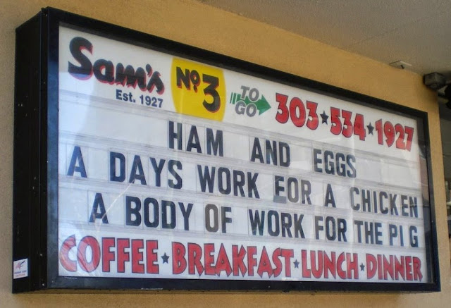 Ham and Eggs - A days work for a chicken. A body of work for the pig. Sign spotted at Sam's Diner No. 3 in Denver in 2009