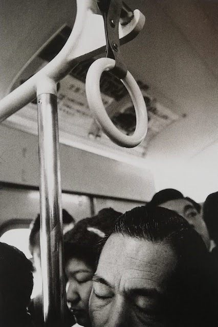 “Man sleeping on commuter line”. Tokyo, 1960. ©Shigeichi Nagano