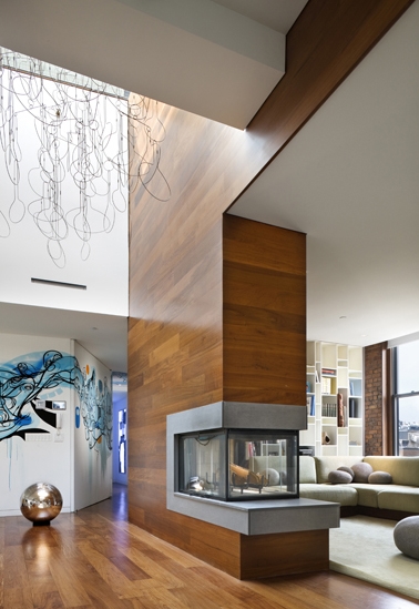 Photo of huge wooden fireplace in the penthouse