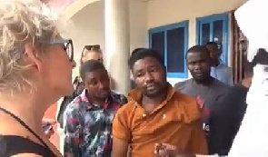 Video: White lady tracks down Ghanaian yahoo boy, gets him arrested for defrauding her of over 20,000 euros