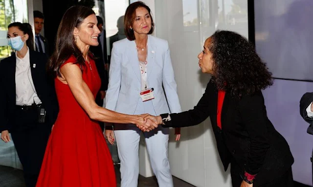 Queen Letizia wore a red fit-and-flare zip-front dress by Carolina Herrera. The Queen is wearing Jose Luis Joyerias gold earrings