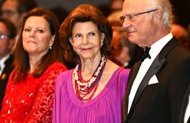 Queen Silvia attended the award ceremony of The Birgit Nilsson Prize. Cellist Yo-Yo Ma. Queen Silvia wore a purple gown