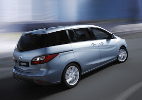 Blue 2012 Mazda 5 rear view in motion