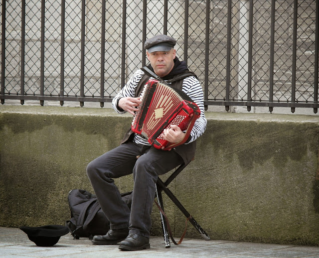 Paris busker musician accordian player