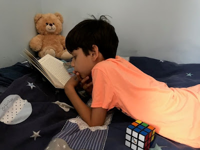 Child reading in his bedroom