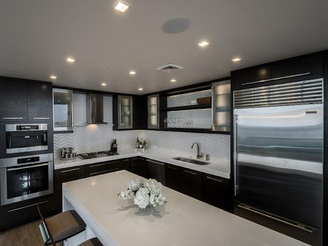 Photo of modern brown kitchen in Philadelphia penthouse