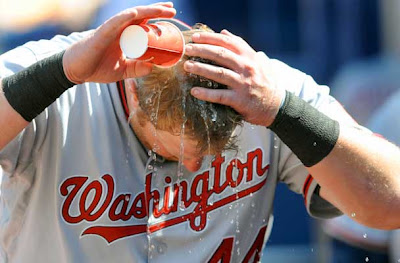 #44 of the Washington Nationals seeks pours water on his head during the game against the Atlanta Braves at Turner Field in Atlanta, Georgia